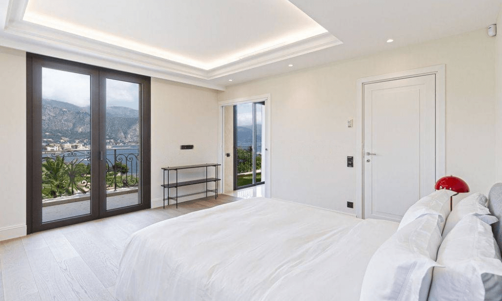 Wide-angle view of villa overlooking coastal landscape